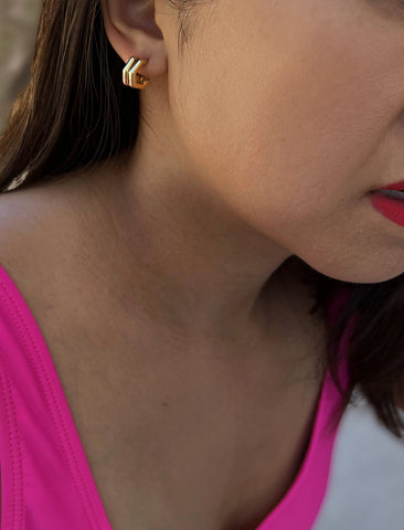 Image Title Female model has an ear stack, wearing minimalist small chunky bold thick dainty stacking layering statement round FUTURISTIC Double Hexagon Huggie Hoop Earrings in 18K Gold Vermeil With 925 Sterling Silver base by Sonia Hou, a celebrity AAPI Chinese demi-fine jewelry designer