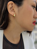 Female model wearing BOSS 18K GOLD VERMEIL OVER STERLING SILVER MINIMALIST CHUBBY MINI SMALL ROUND HOOP EARRINGS by Sonia Hou Jewelry