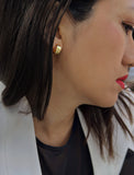 Female model wearing BOSS 18K GOLD VERMEIL OVER STERLING SILVER MINIMALIST CHUBBY MINI SMALL ROUND HOOP EARRINGS by Sonia Hou Jewelry