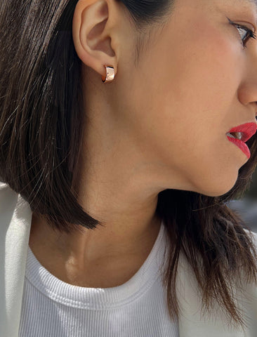 Image Title Female model wearing BOSS 18K ROSE GOLD VERMEIL OVER STERLING SILVER MINIMALIST CHUBBY MINI SMALL ROUND HOOP EARRINGS by Sonia Hou Jewelry
