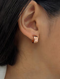 Image Title Female model wearing BOSS 18K ROSE GOLD VERMEIL OVER STERLING SILVER MINIMALIST CHUBBY MINI SMALL ROUND HOOP EARRINGS by Sonia Hou Jewelry