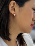Image Title Female model wearing BOSS 18K ROSE GOLD VERMEIL OVER STERLING SILVER MINIMALIST CHUBBY MINI SMALL ROUND HOOP EARRINGS by Sonia Hou Jewelry