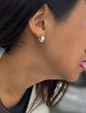 Female model wearing minimalist dainty small thick bold everyday BOSS 925 Sterling Silver Chubby Mini Huggie Hoop Earrings by Sonia Hou, a celebrity Chinese AAPI demi-fine fashion costume jewelry designer