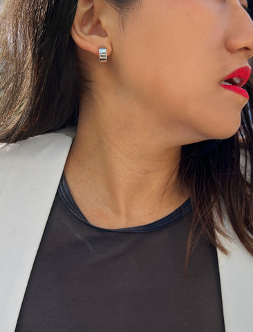 Image Title Female model wearing minimalist dainty small thick bold everyday BOSS 925 Sterling Silver Chubby Mini Huggie Hoop Earrings by Sonia Hou, a celebrity Chinese AAPI demi-fine fashion costume jewelry designer