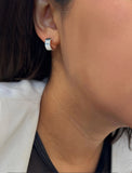 Image Title Female model wearing minimalist dainty small thick bold everyday BOSS 925 Sterling Silver Chubby Mini Huggie Hoop Earrings by Sonia Hou, a celebrity Chinese AAPI demi-fine fashion costume jewelry designer