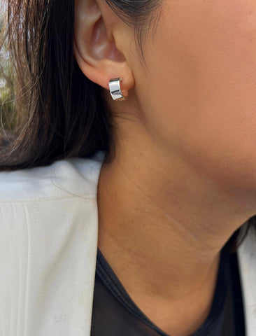 Image Title Female model wearing minimalist dainty small thick bold everyday BOSS 925 Sterling Silver Chubby Mini Huggie Hoop Earrings by Sonia Hou, a celebrity Chinese AAPI demi-fine fashion costume jewelry designer