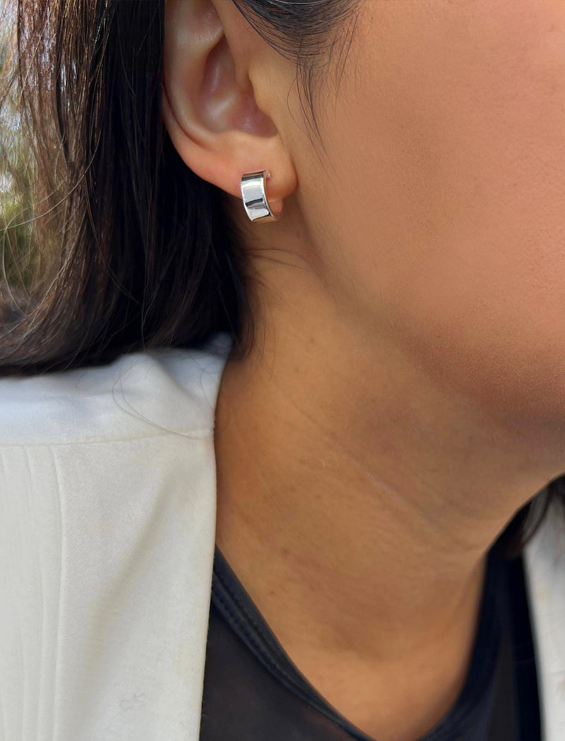 Image Title Female model wearing minimalist dainty small thick bold everyday BOSS 925 Sterling Silver Chubby Mini Huggie Hoop Earrings by Sonia Hou, a celebrity Chinese AAPI demi-fine fashion costume jewelry designer