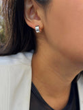 Image Title Female model wearing minimalist dainty small thick bold everyday BOSS 925 Sterling Silver Chubby Mini Huggie Hoop Earrings by Sonia Hou, a celebrity Chinese AAPI demi-fine fashion costume jewelry designer