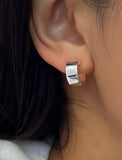 Female model wearing minimalist dainty small thick bold everyday BOSS 925 Sterling Silver Chubby Mini Huggie Hoop Earrings by Sonia Hou, a celebrity Chinese AAPI demi-fine fashion costume jewelry designer