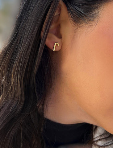 Image Title Female model wearing Candy Cane Holiday Festive Christmas Earrings in 18K Gold Over With Sterling Silver by AAPI Celebrity Jewelry Designer Sonia Hou