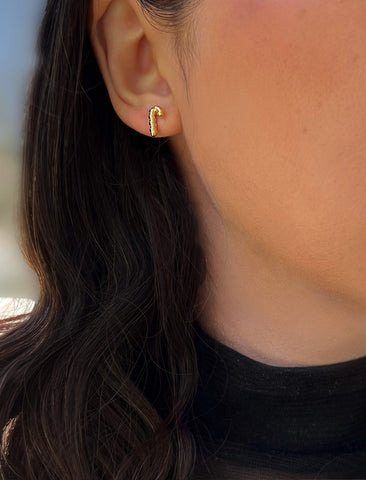 Image Title Female model wearing Candy Cane Holiday Festive Christmas Earrings in 18K Gold Over With Sterling Silver by AAPI Celebrity Jewelry Designer Sonia Hou