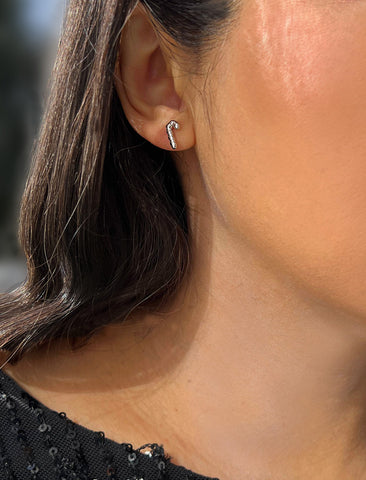 Image Title Female model wearing Candy Cane Holiday Festive Christmas Earrings in Sterling Silver by AAPI Celebrity Jewelry Designer Sonia Hou