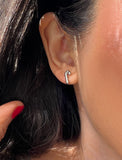 Image Title Female model wearing Candy Cane Holiday Festive Christmas Earrings in Sterling Silver by AAPI Celebrity Jewelry Designer Sonia Hou