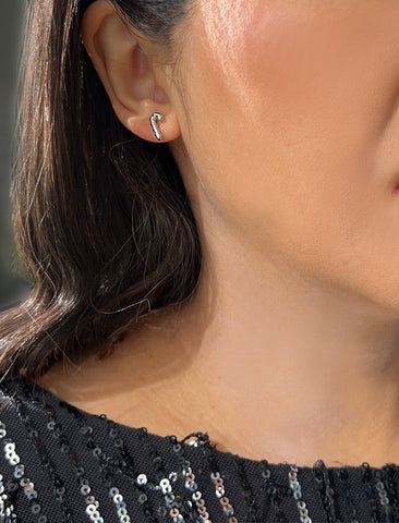 Image Title Female model wearing Candy Cane Holiday Festive Christmas Earrings in Sterling Silver by AAPI Celebrity Jewelry Designer Sonia Hou