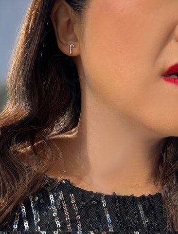 Image Title Female model wearing Candy Cane Holiday Festive Christmas Earrings in Sterling Silver by AAPI Celebrity Jewelry Designer Sonia Hou