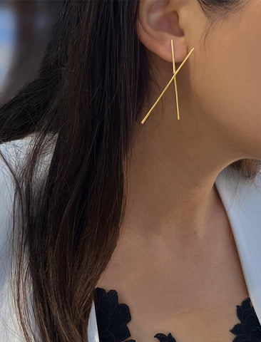 Image Title Female Model wearing Asian Inspired Chopsticks Minimalist Long Thin Dangle Earrings in 18K Gold Vermeil With Sterling Silver base by Sonia Hou, a celebrity AAPI demi-fine jewelry designer