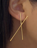 Image Title Female Model wearing Asian Inspired Chopsticks Minimalist Long Thin Dangle Earrings in 18K Gold Vermeil With Sterling Silver base by Sonia Hou, a celebrity AAPI demi-fine jewelry designer.