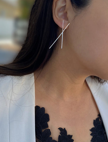 Image Title Female model wearing Asian Inspired Chopsticks Minimalist Long Thin Dangle Earrings in Sterling Silver base by Sonia Hou, a celebrity AAPI demi-fine jewelry designer.