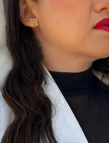 Image Title Female model wearing Holiday Coquette Bow Festive Christmas Stud Earrings in 18K Gold Over With Sterling Silver by AAPI Celebrity Jewelry Designer Sonia Hou