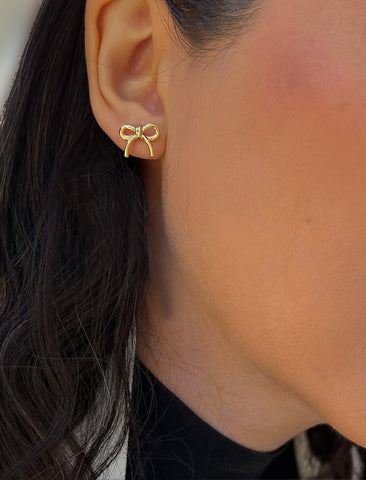 Image Title Female model wearing Holiday Coquette Bow Festive Christmas Stud Earrings in 18K Gold Over With Sterling Silver by AAPI Celebrity Jewelry Designer Sonia Hou