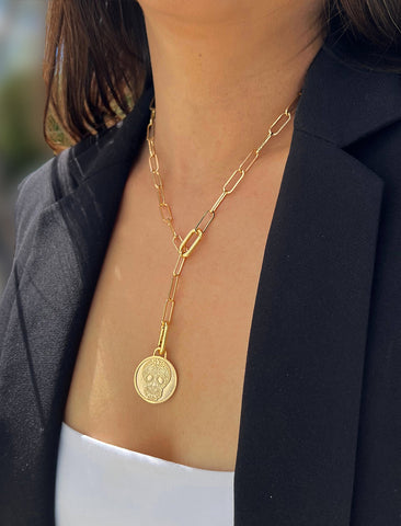 Image Title Female model wearing gender neutral, culturally inclusive Day Of The Dead Mexican Sugar Skull Charm 3-Way Convertible Coin Pendant with a Large Paperclip Link Chain Statement Bold Thick Chunky Layering Stacking Rectangular Necklace in 18K Gold Vermeil Over Sterling Silver by Sonia Hou, a celebrity AAPI Chinese demi-fine jewelry designer. This holiday is also known as Dia De Los Muertos, and can also be worn for Halloween!