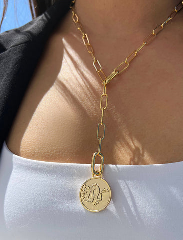 Image Title Female model wearing gender neutral Asian Inspired Lucky Chinese Zodiac Dragon Charm 3-Way Convertible Coin Pendant with a Large Paperclip Link Chain Statement Bold Thick Chunky Layering Stacking Rectangular Necklace in 18K Gold Vermeil Over Sterling Silver by Sonia Hou, a celebrity AAPI Chinese demi-fine jewelry designer. Promotes good luck, wisdom, wealth, power and good fortune