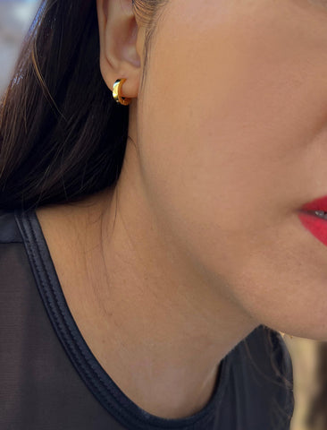 Image Title Woman wearing Essential Minimalist 18K Gold Vermeil With 925 Sterling Silver base mini small tiny chunky bold thick dainty stacking layering statement round hoop huggie earrings by Sonia Hou, a celebrity AAPI Chinese demi-fine jewelry designer
