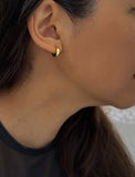 Woman wearing Essential Minimalist 18K Gold Vermeil With 925 Sterling Silver base mini small tiny chunky bold thick dainty stacking layering statement round hoop huggie earrings by Sonia Hou, a celebrity AAPI Chinese demi-fine jewelry designer