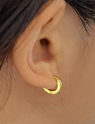 Image Title Female model wearing Essential Minimalist 18K Gold Vermeil With 925 Sterling Silver base mini small tiny chunky bold thick dainty stacking layering statement round hoop huggie earrings by Sonia Hou, a celebrity AAPI Chinese demi-fine jewelry designer