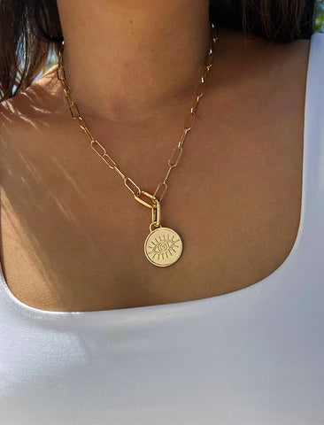 Image Title Female model wearing gender neutral, culturally inclusive Evil Eye Lucky Charm 3-Way Convertible Coin Pendant with a Large Paperclip Link Chain Statement Bold Thick Chunky Layering Stacking Rectangular Necklace in 18K Gold Vermeil Over Sterling Silver by Sonia Hou, a celebrity AAPI Chinese demi-fine jewelry designer.