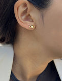 Female model wearing tiny dainty small minimalist inclusive Evil Eye Stud Earrings, inspired by Greek culture, in 18K Gold Vermeil With Sterling Silver base by Sonia Hou, a celebrity AAPI Chinese demi-fine fashion costume jewelry designer