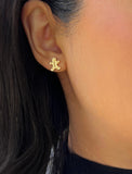 Image Title Female model wearing Gingerbread Holiday Festive Christmas Earrings in 18K Gold Over With Sterling Silver by AAPI Celebrity Jewelry Designer Sonia Hou