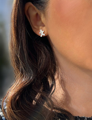Image Title Female model wearing Gingerbread Holiday Festive Christmas Earrings in Sterling Silver by AAPI Celebrity Jewelry Designer Sonia Hou