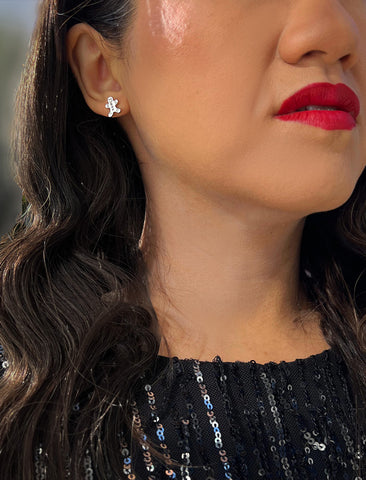 Image Title Female model wearing Gingerbread Holiday Festive Christmas Earrings in Sterling Silver by AAPI Celebrity Jewelry Designer Sonia Hou