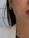 Image Title Woman wearing Minimalist mini tiny small chunky bold thick dainty stacking layering statement round INNOVATE Hexagon Huggie Hoop Earrings in 925 Sterling Silver by Sonia Hou, a celebrity Asian AAPI Chinese demi-fine jewelry designer