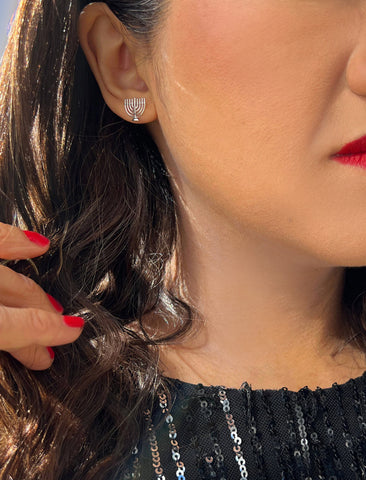 Image Title Female model wearing Menorah Jewish Hanukkah Holiday Festive Earrings in Sterling Silver by AAPI Celebrity Jewelry Designer Sonia Hou