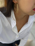 Image Title Female model wearing big medium large thin round circle PERFECT 50mm or 2 inch hoop stacking lightweight everyday statement earrings in 18K Gold Vermeil With 925 Sterling Silver base by Sonia Hou, a celebrity AAPI Chinese demi-fine jewelry designer