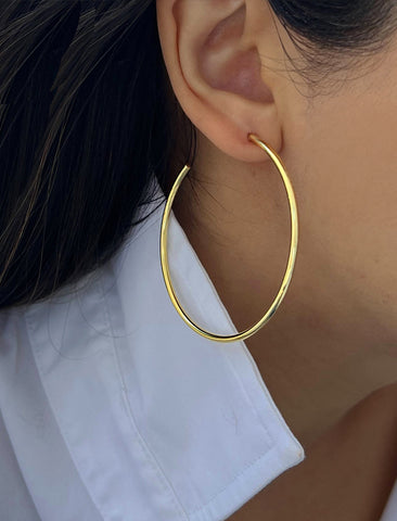 Image Title Female model wearing big medium large thin round circle PERFECT 50mm 2 inch hoop stacking lightweight everyday statement earrings in 18K Gold Vermeil With 925 Sterling Silver base by Sonia Hou, a celebrity AAPI Chinese demi-fine jewelry designer