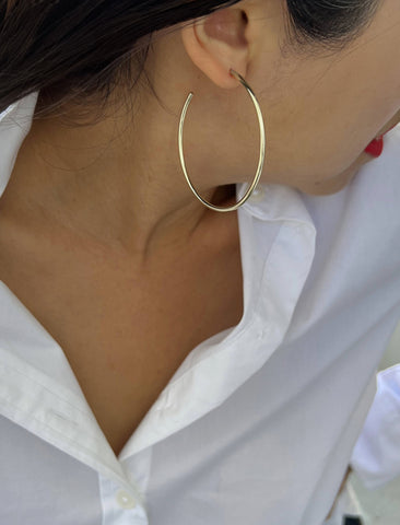Image Title Female model wearing big medium large thin round circle PERFECT 50mm 2 inch hoop stacking lightweight everyday statement earrings in 925 Sterling Silver by Sonia Hou, a celebrity AAPI Chinese demi-fine jewelry designer