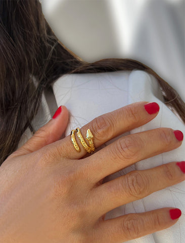 Image Title Woman wearing Culturally inclusive Chinese Zodiac Wood Snake x Taylor Swift inspired Reputation ring in 18k gold over Sterling Silver by Sonia Hou, a celebrity AAPI Chinese demi-fine jewelry designer. Perfect for Halloween, Lunar New Year or Swifties at Taylor Swift concerts!
