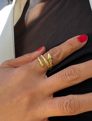 Image Title Woman wearing Culturally inclusive Chinese Zodiac Wood Snake x Taylor Swift inspired Reputation ring in 18k gold over Sterling Silver by Sonia Hou, a celebrity AAPI Chinese demi-fine jewelry designer. Perfect for Halloween, Lunar New Year or Swifties at Taylor Swift concerts!