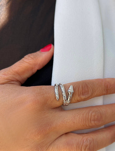 Image Title Woman wearing Culturally inclusive Chinese Zodiac Wood Snake x Taylor Swift inspired Reputation ring in Sterling Silver by Sonia Hou, a celebrity AAPI Chinese demi-fine jewelry designer. Perfect for Halloween, Lunar New Year or Swifties at Taylor Swift concerts!