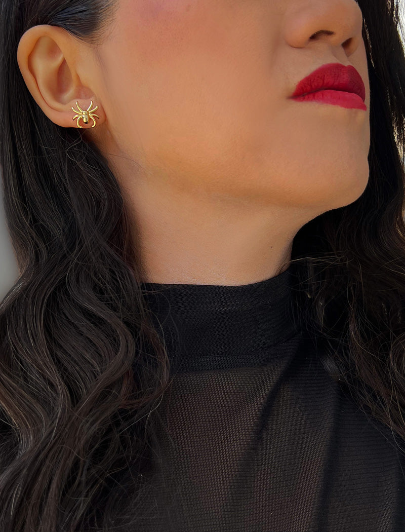 Image Title Woman wearing Gold Spider Halloween Earrings in 18K Gold Over With Sterling Silver by AAPI Celebrity Jewelry Designer Sonia Hou