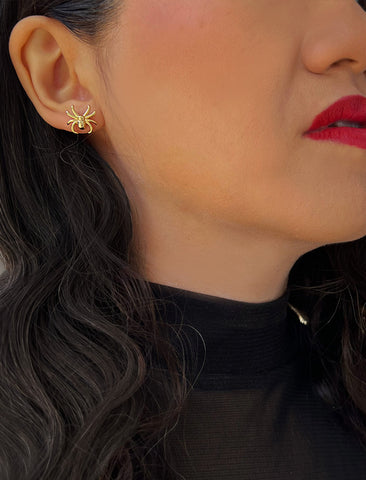 Image Title Woman wearing Gold Spider Halloween Earrings in 18K Gold Over With Sterling Silver by AAPI Celebrity Jewelry Designer Sonia Hou