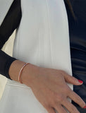 Female model wearing adjustable minimalist simple Success Thin Cuff Chunky Bold Layering Stacking Statement 2 Way convertible Bangle Cuff Open Bracelet in 18K rose gold vermeil with 925 sterling silver base by Sonia Hou, a celebrity AAPI Chinese demi-fine fashion costume jewelry designer