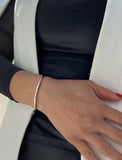 Female model wearing adjustable minimalist simple Success Thin Cuff Chunky Bold Layering Stacking Statement 2 Way convertible Bangle Cuff Open Bracelet in 925 sterling silver by Sonia Hou, a celebrity AAPI Chinese demi-fine fashion costume jewelry designer