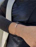 Female model wearing adjustable minimalist simple Success Thin Cuff Chunky Bold Layering Stacking Statement 2 Way convertible Bangle Cuff Open Bracelet in 925 sterling silver by Sonia Hou, a celebrity AAPI Chinese demi-fine fashion costume jewelry designer