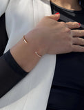 Image Title Female model wearing adjustable minimalist simple Success Thin Cuff Chunky Bold Layering Stacking Statement 2 Way convertible Bangle Cuff Open Bracelet in 18K rose gold vermeil with 925 sterling silver base by Sonia Hou, a celebrity AAPI Chinese demi-fine fashion costume jewelry designer