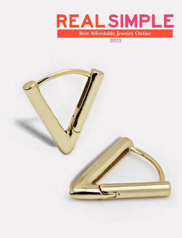 Image Title Female model wearing ACHIEVE TRIANGLE GEOMETRIC HUGGIE EARRINGS in Sterling Silver by Sonia Hou Jewelry