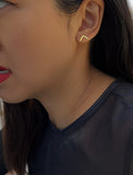 Image Title Female model wearing small modern geometric minimalist simple 2-way convertible TRILL dainty wishbone diamond front back ear jacket stud earrings in 18K gold vermeil with 925 sterling silver base by Sonia Hou, a celebrity AAPI Chinese demi-fine fashion costume jewelry designer